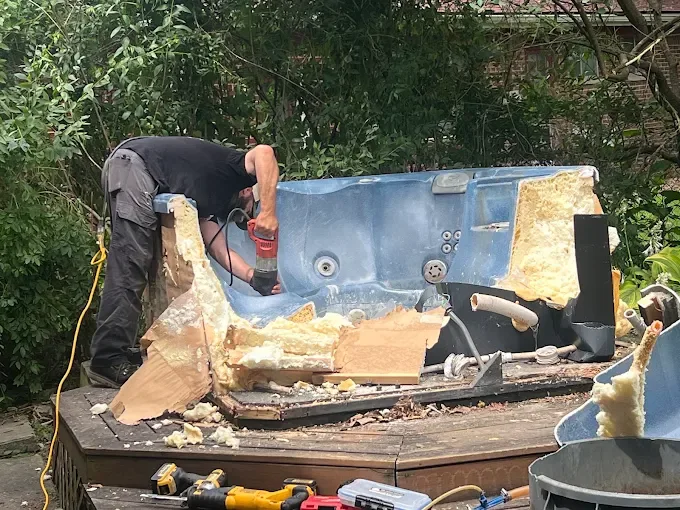 Dismantled hot tub material during removal