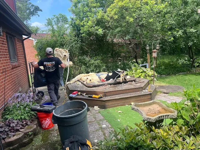 Hot tub removal in progress on the deck